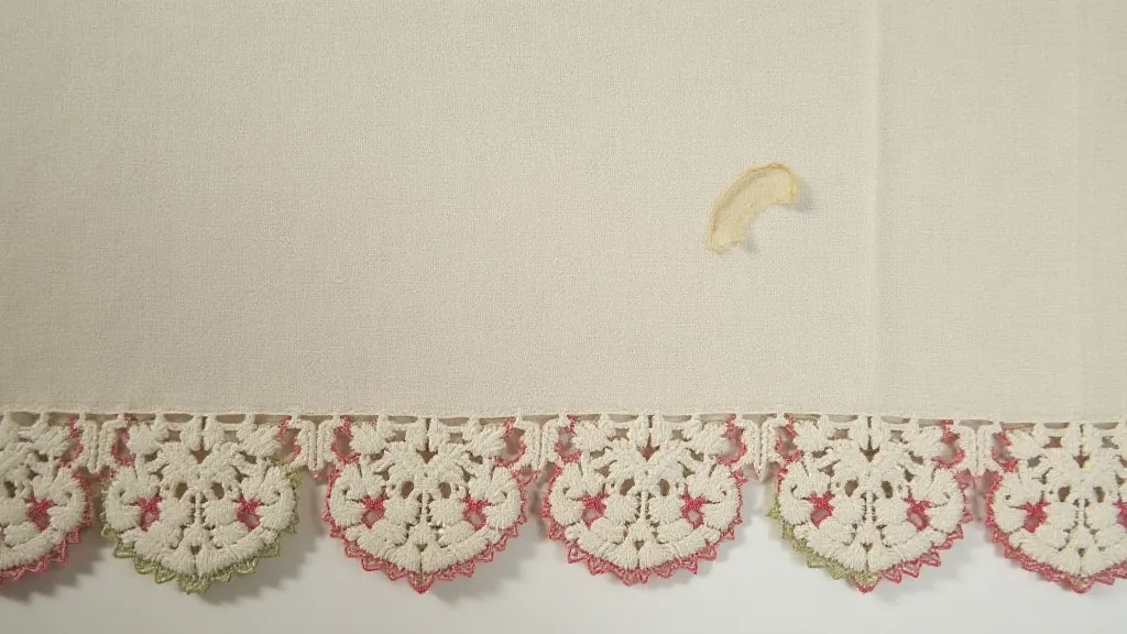 Hand-darned repair on antique handkerchief